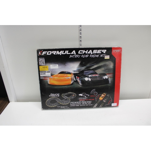 102 - A boxed Formula chaser racing set