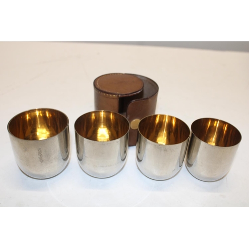 159 - A set of five vintage stirrup cups in a leather case