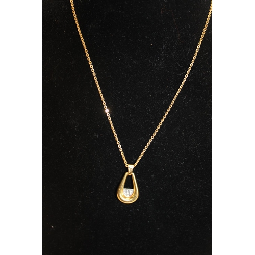 161 - A 18ct gold & diamond pendant and chain. (9.63 grams)