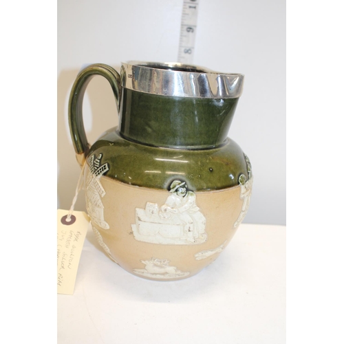 163A - A salt glazed Doulton Lambeth silver rimmed harvest jug. Hallmarked for 1892