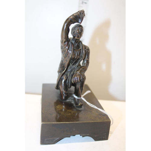 172B - An unusual bronze sculpture of a kneeling man