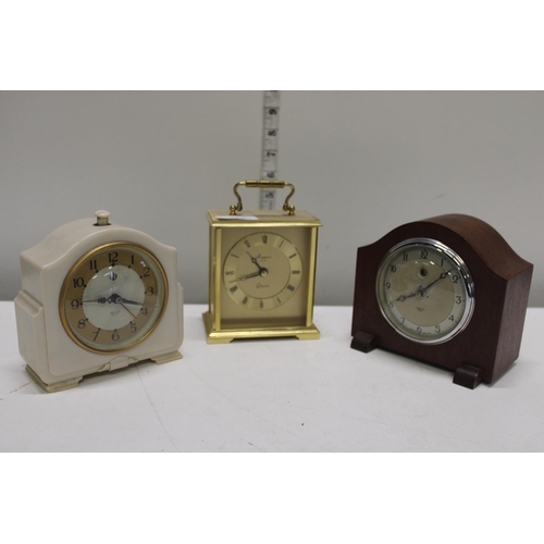 319 - Two vintage Smiths clocks and a Rapport brass carriage clock