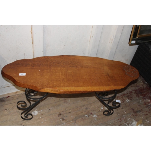 90 - A vintage wooden table with carved acorn decoration on metal legs. Postage unavailable 93cm long