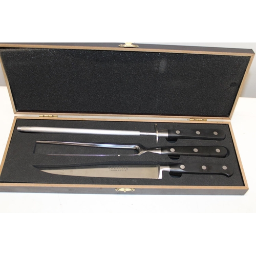 36 - A boxed Sabatier carving set