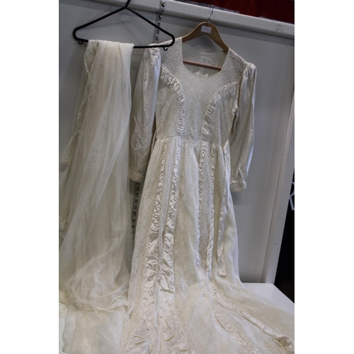 426 - A vintage wedding dress with veil