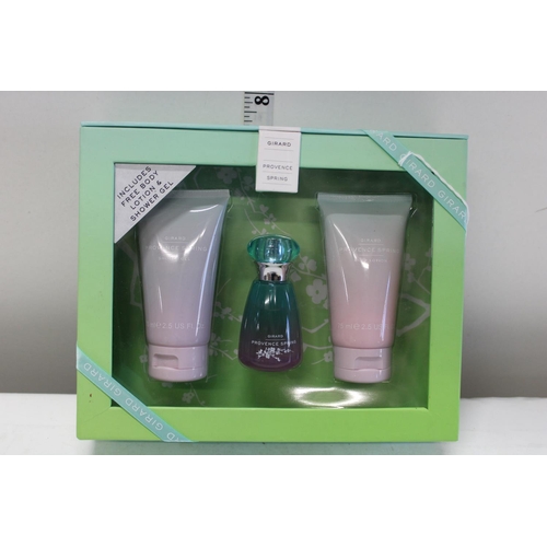 64 - A boxed Girard lotion and shower gel set