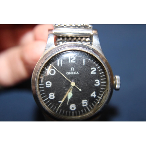 114 - A vintage Omega 1950's Air Ministry pilots watch in good working order. Has a replacement strap. Sli... 