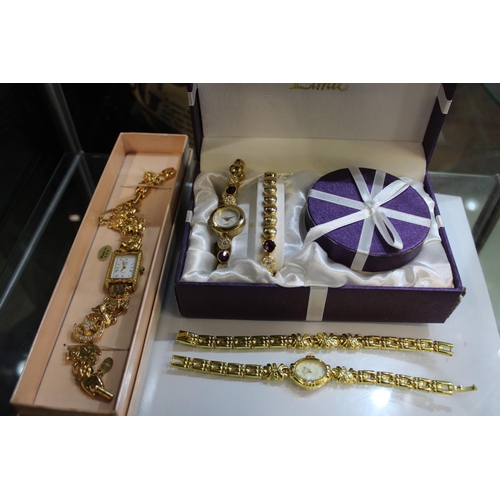 135 - A selection of Ladies gold tone watches and bracelets