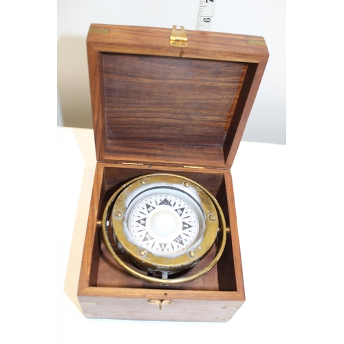 300 - A boxed brass gimbal compass