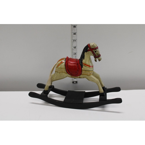 34A - A vintage miniature child's wooden rocking horse