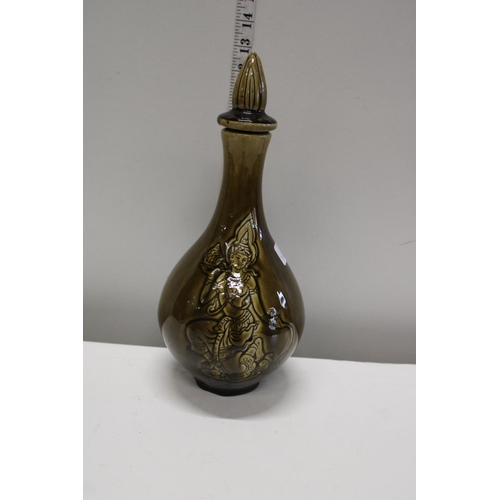 43 - A green glazed Thai themed decanter with stopper