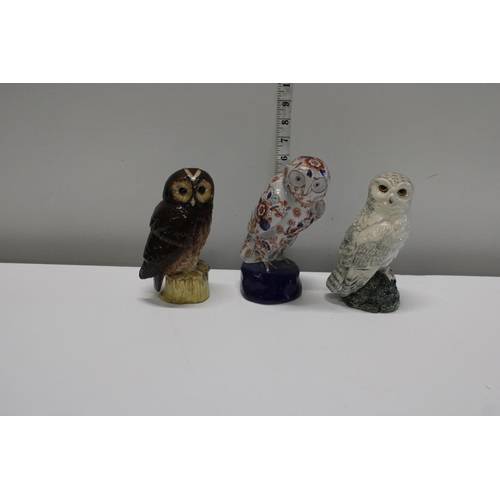 8 - Three owl themed whiskey decanters including two Royal Doulton examples
