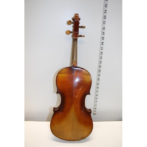 44 - An antique Stradivarius copy violin in an early coffin carry case with bows (Sold as seen)