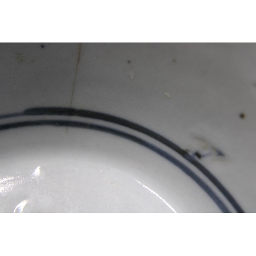 290 - An antique Chinese blue and white bowl (has hairline crack ) on a carved wooden base. Ship wreck fin... 