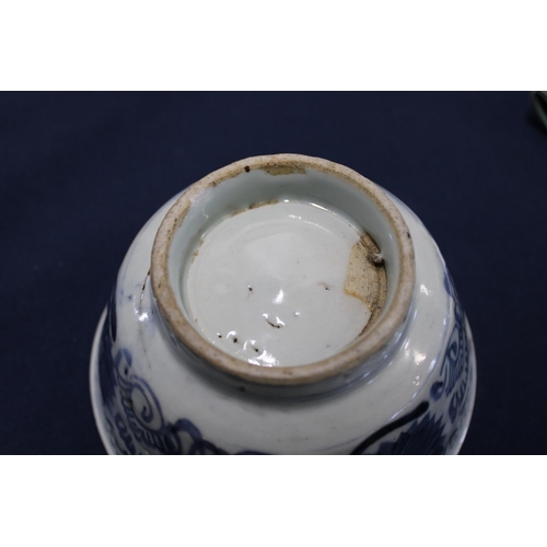 290 - An antique Chinese blue and white bowl (has hairline crack ) on a carved wooden base. Ship wreck fin... 