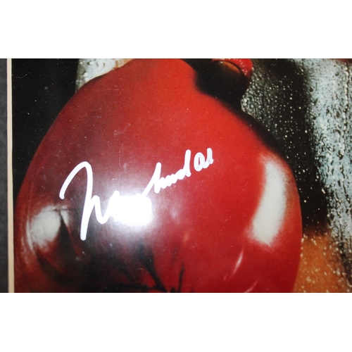 302 - Photograph of and signed by Mohammed Ali