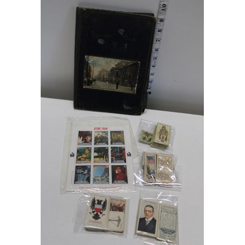 48 - A selection of vintage cigarette cards and stamps