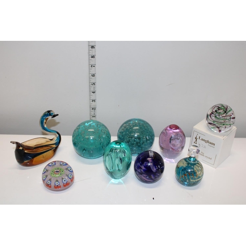 142 - A selection of assorted glass paperweights including signed Mdina