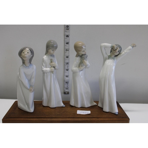 157 - Four Spanish porcelain figures on wooden display stand (one a/f)