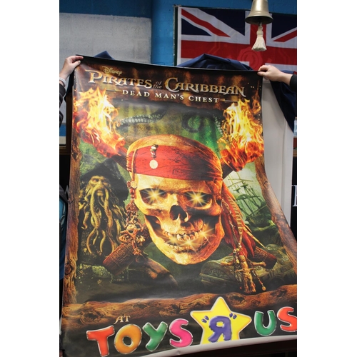 196 - A large Toys R Us Pirates of the Caribbean poster. Postage unavailable