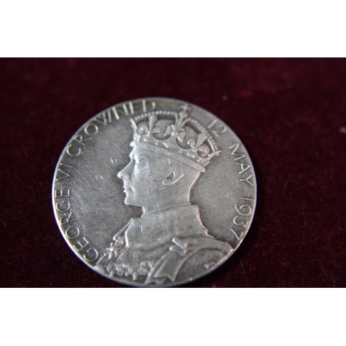 112 - A 1937 silver Coronation medal