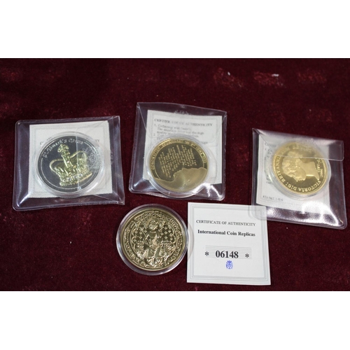 149 - Four assorted collectors coins