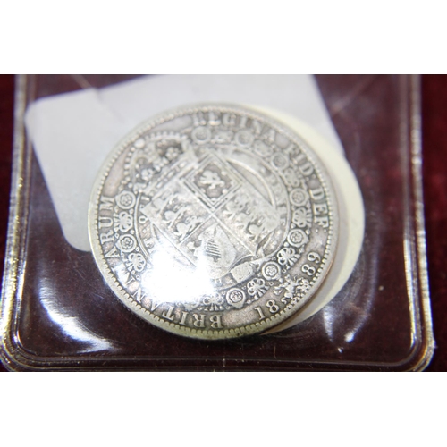 153 - A 1889 Victorian one shilling coin. (F)