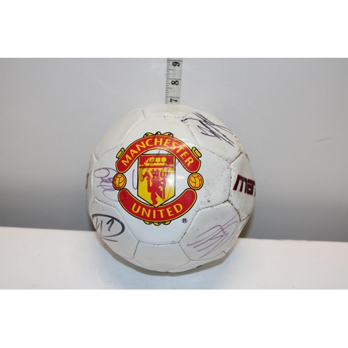 214 - A signed Man United football from the 1990's