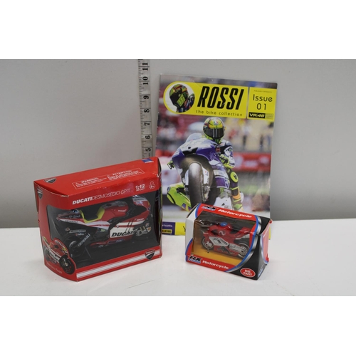 23 - Two boxed die-cast motorbike models