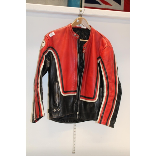 411 - A vintage leather motorbike jacket