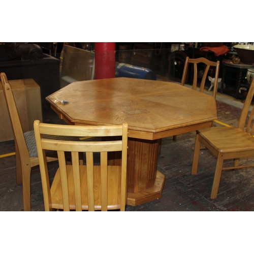 415 - A hexagonal shaped wooden table and chairs. postage unavailable