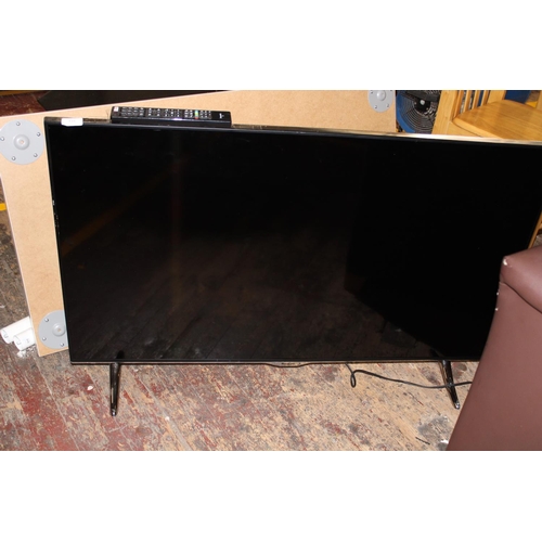 416 - A Panasonic flat screen TV on stand with remote. Postage unavailable