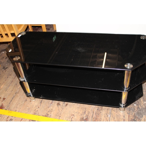 419 - A black glass media unit