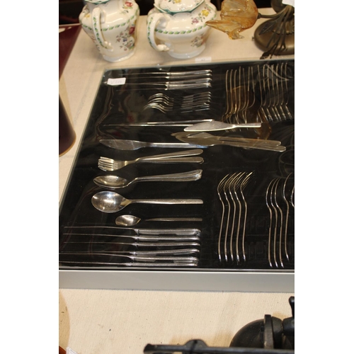 43 - A cased set of stainless steel cutlery. postage unavailable