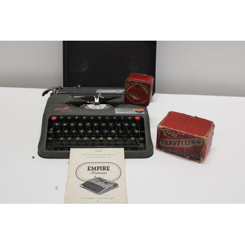 54 - A vintage Empire portable typewriter & other items.  Postage unavailable