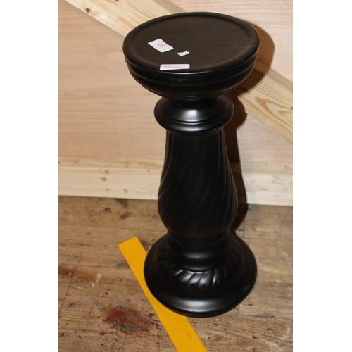 65 - A black ceramic planter stand. postage unavailable