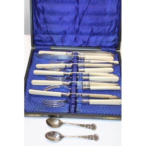 216 - A cased set of vintage cutlery & two silver tea spoons