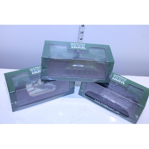 112 - Three boxed Atlas tank models