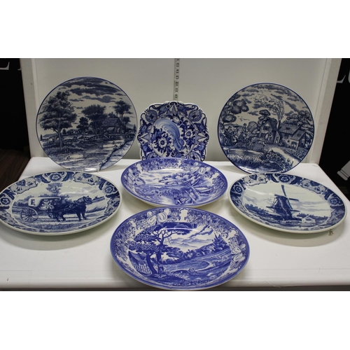 287 - A large collection of blue and white charger plates