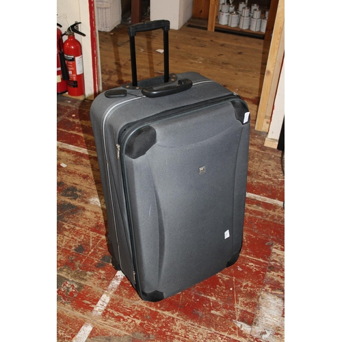 291 - A large wheeled suitcase, postage unavailable