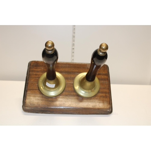 306 - A pair of vintage brass and wood hand pull beer pumps