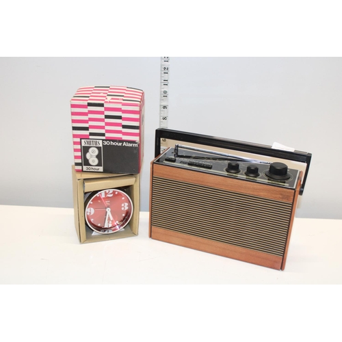 156 - A vintage portable radio and a Smiths 30 hour alarm clock