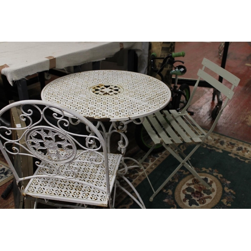 150 - A vintage metal garden table and two chairs. collection only