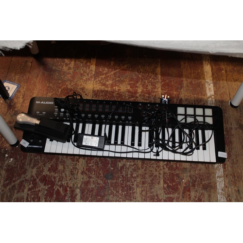 183 - A oxygen 49 electronic keyboard, postage unavailable