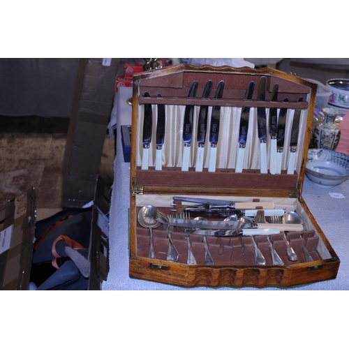 250 - A wooden cutlery box and contents