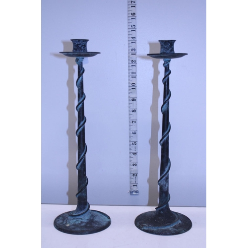 7 - A pair of bronze candlesticks