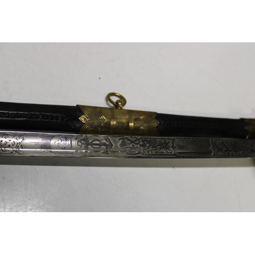 133 - A Royal Navy officers sword and scabbard 1827 pattern made between 1901-53 with leather grip and cop... 