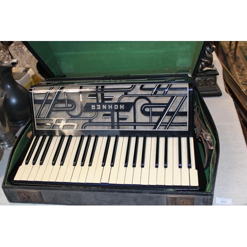 231 - A vintage Hohner Verdi iii accordion, shipping unavailable