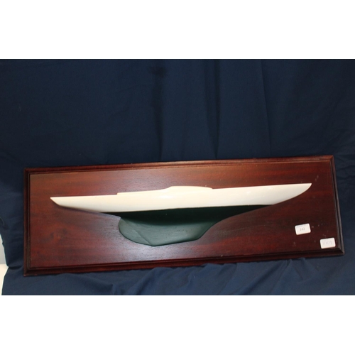 206 - A Fibreglass ships hull mounted on a mahogany plinth (postage unavailable)