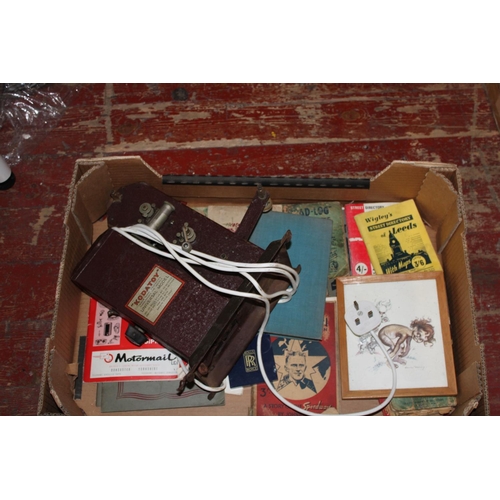 184 - A box of assorted vintage books and a projector. Postage unavailable